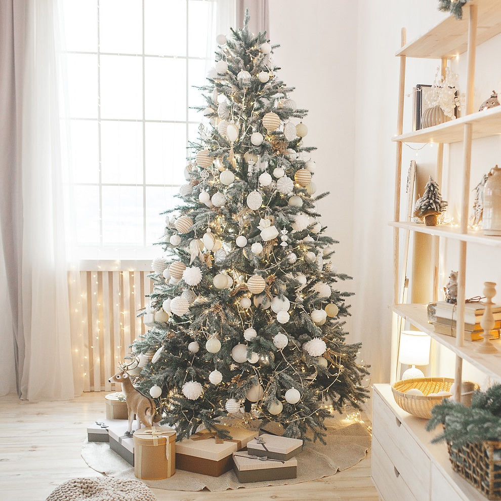 A Christmas tree trimmed in gold and white.